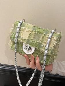 Green quilted tweed shoulder bag with silver chain and fringe details for casual wear
