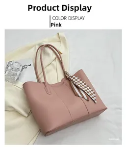 Pink leather tote bag with a checkered silk scarf accessory in a lifestyle setting