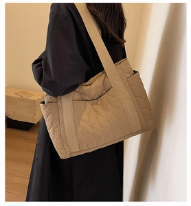 Quilted khaki tote bag side view showing large capacity and leaf pattern texture