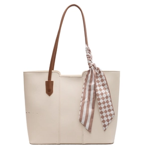 Minimalist cream white tote bag with brown handles and stylish silk scarf detail