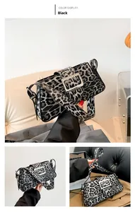 Detail view of leopard print shoulder bag with bold silver metal buckle and wide strap