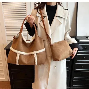 Detail view of brown suede tote and crossbody bag set with white faux shearling trim decor