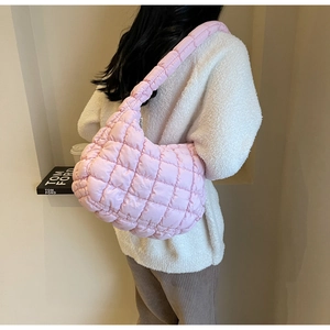 Detailed back view of a soft pink quilted cloud bag showing fluffy nylon texture