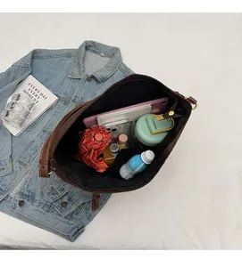 Internal view of large brown corduroy tote bag showing spacious capacity for daily items