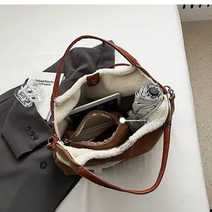 Interior view of brown suede tote bag showing large capacity and inner pouch
