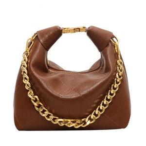 Brown quilted leather dumpling bag with gold chain strap shown on white background