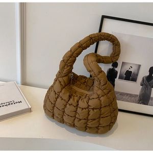 Detail of quilted puffy hobo bag in coffee brown with soft nylon padding and zipper