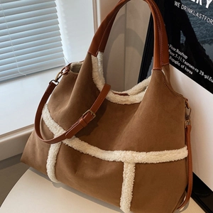 Brown suede tote bag with white faux fur trim and adjustable leather shoulder strap