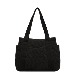 Black large capacity quilted tote bag with leaf pattern and thick fabric straps