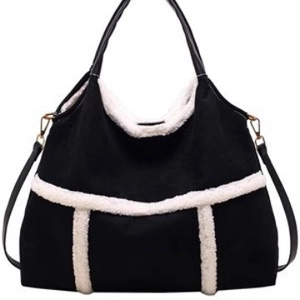 Black suede tote bag with white faux fur trim and adjustable crossbody strap
