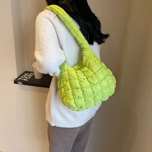 Fluorescent green quilted cloud bag featuring a large capacity padded hobo design