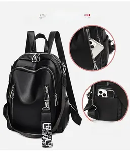 Detail view of large capacity faux leather backpack with stylish geometric shoulder strap