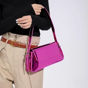 Macro detail of glossy purple patent leather surface on this rectangular baguette bag