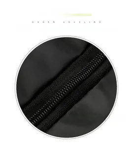 Detail shot of the durable metal zipper and nylon webbing on a black oxford tote bag
