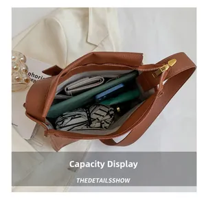 Brown lychee leather shoulder bag with large capacity showing wallet and umbrella inside