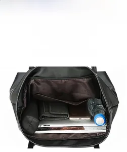 Spacious interior of black Oxford tote bag showing storage for tablet and water bottle