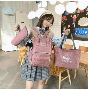 Three-piece mummy bag set with quilted pink-purple pattern including backpack and tote bag