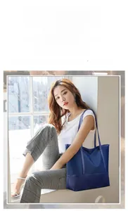 Detailed view of dark blue Oxford tote bag with glossy finish and large capacity