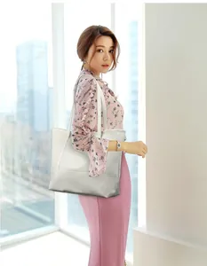 Close-up of white oversized Oxford cloth tote bag with premium stitching and shoulder strap