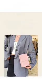 Pink mini leather chain bag styled with urban professional outfit for modern fashion look