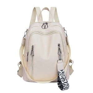 Fashionable cream soft leather backpack for women with decorative zippers and patterned strap