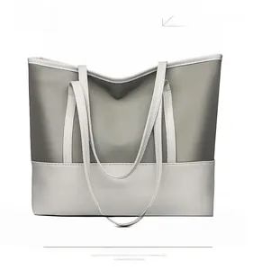 Detailed close-up of gray Oxford fabric tote bag with cream-colored dual handles