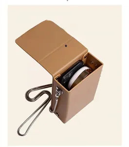 Internal view of a khaki leather mini crossbody bag showing mobile phone storage space