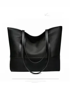 Detail view of the black Oxford cloth tote bag with premium leather stitching and large capacity