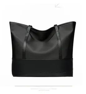 Back view of a large black oxford cloth tote bag with reinforced stitching details