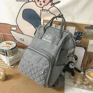 Detailed view of the large capacity grey quilted mummy backpack with durable fabric