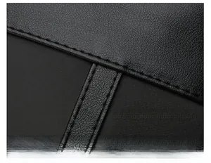Close-up of premium black lychee leather texture with precise stitching and refined finish