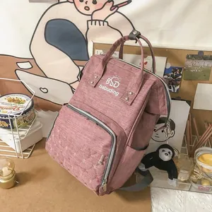 Detail of pink quilted star backpack with large opening and practical side pockets