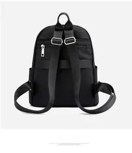 Detail view of the nylon quilted backpack with adjustable straps and metal buckles
