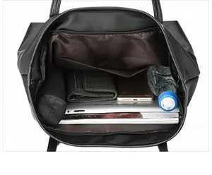 Interior view showing the spacious storage capacity of this black Oxford cloth tote bag