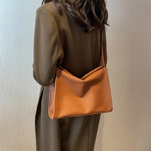 Minimalist orange-brown large capacity tote bag with lychee grain leather texture
