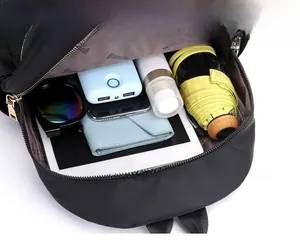Interior view of the quilted nylon backpack showing organized storage for tablets and more