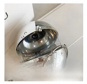 Detail view of spherical transparent acrylic bag with silver chain and metal buckle
