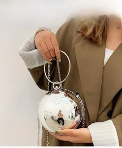 Silver spherical acrylic evening bag with metal handle and detachable chain strap