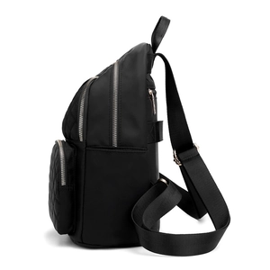 Fashionable black quilted nylon backpack for women with multi-layer silver zippers