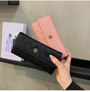Quilted leather long wallets in black and pink with elegant golden camellia hardware detail