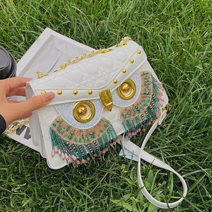Quirky white owl crossbody bag with diamond quilting and colorful beaded tassels