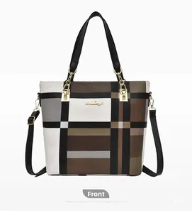Front detail of large tote bag featuring a checkered patchwork pattern and gold logo