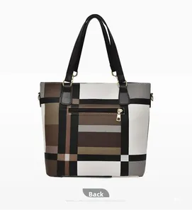 Close-up of the back of a large plaid tote bag showing the exterior zipper pocket