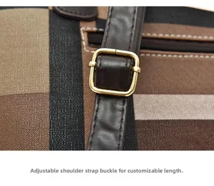Close-up of adjustable gold-tone buckle on dark brown leather strap of checkered tote bag