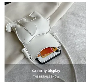 Détails intérieurs du sac éléphant montrant l'espace pour téléphone et les cartes