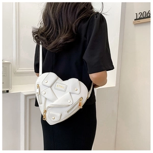 White heart-shaped crossbody bag with biker jacket zipper details and golden hardware
