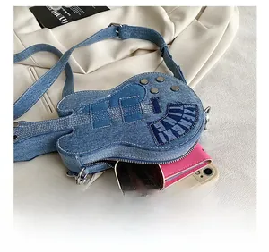 Guitar-shaped denim crossbody bag showcasing internal storage for phone and accessories