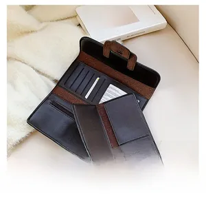 Macro shot of bicolor leather wallet featuring multi-card slots and a zipper compartment