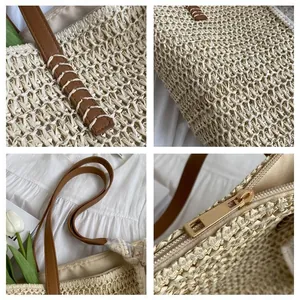 Close-up of beige woven tote bag detailing brown leather straps with white hand-stitching