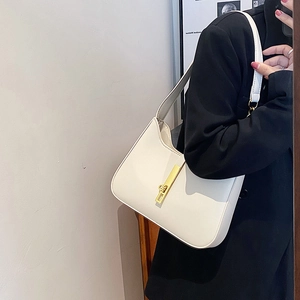 Minimalist white faux leather underarm bag with gold lock buckle and long handle